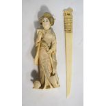 An ivory okimono of a Yamato Nadeshko, holding a samisen with her left hand, 18cm high,