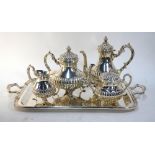 A Peruvian sterling four-piece tea/coffee service of half-reeded pear shape,