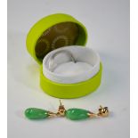 A pair of green jade drop earrings,