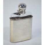 A Victorian cut glass hip flask with hinged bayonet bun cover and detachable curved beaker,