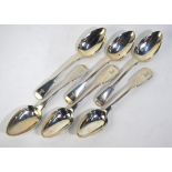 A matched set of six Georgian silver fiddle pattern dessert spoons, London 1811/23,