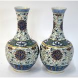 A pair of doucai style vases with flaring necks and trumpet rims,