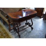 A Regency cross-banded card table, the rectangular fold over top with canted corners, baize lined,