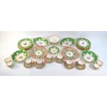A Victorian Staffordshire part dessert service, green ground painted with floral centres,