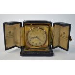 A Zenith Watch Co Swiss gilt metal travel alarm clock with gilt dial, 5.