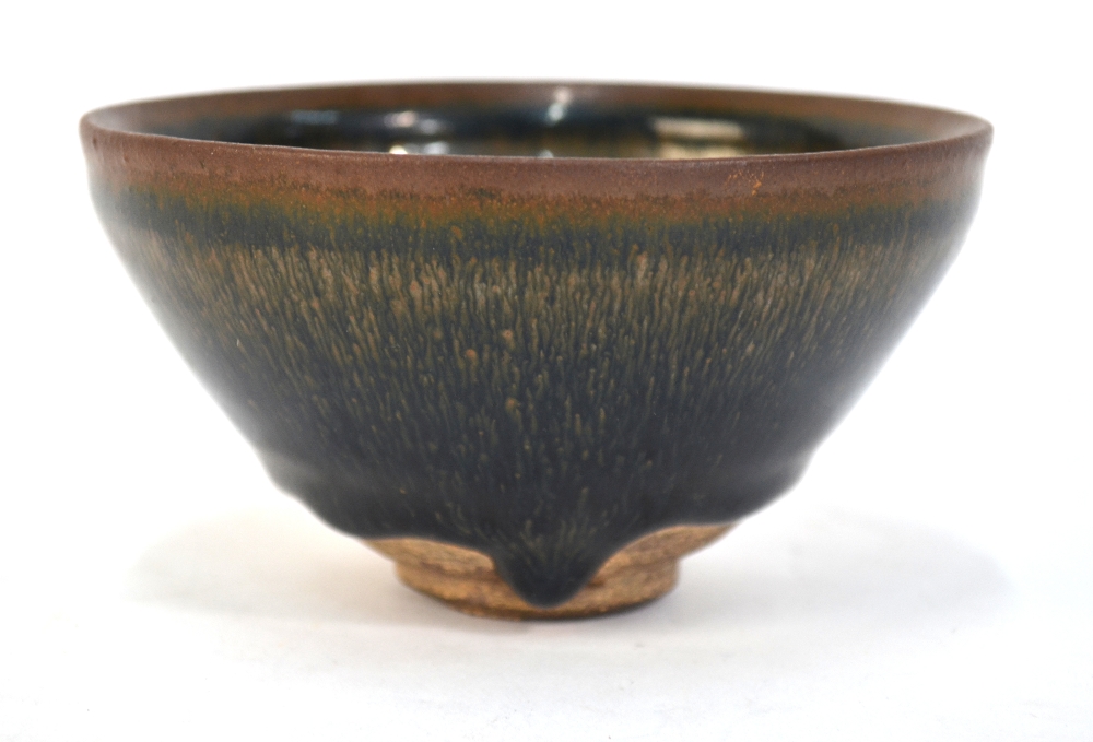 A Song Dynasty style conical bowl decorated with a 'hare's fur' design; the circular foot unglazed,