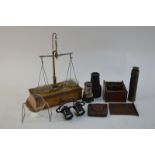 A brass and teak set of travelling scales (collapses into fitted drawer of base),