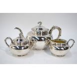 A Chinese white metal part tea-service comprising: a teapot with domed cover and bamboo sprig