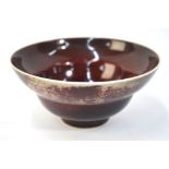 A mottled sang-de-boeuf/lang yao style bowl; 14cm diameter;