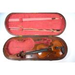 A scarce 19th century mahogany violin double case with brass loop handle and fitted lining,