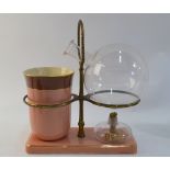 A Staffordshire, or other English, ceramic and glass distillation set,