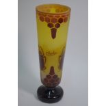 A yellow-ground glass vase on circular foot,