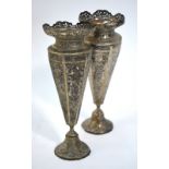 A pair of Indian white metal tapering hexagonal vases;