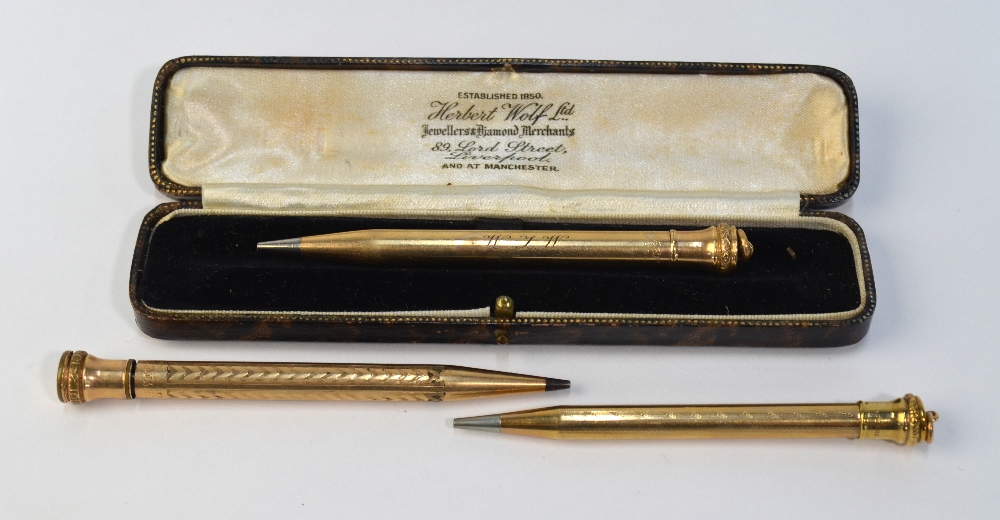 Three propelling pencils - one 9ct cased