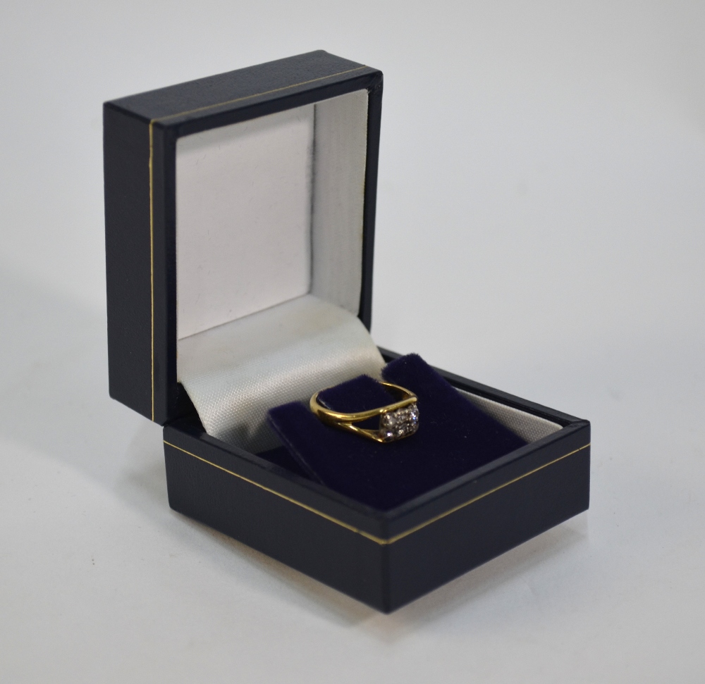 An 18ct yellow gold ring set with six di