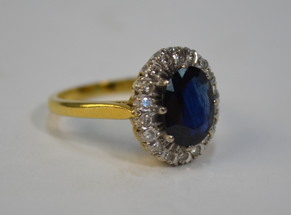 A sapphire and diamond cluster ring, the