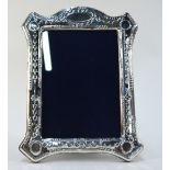 A modern silver-faced photograph frame i