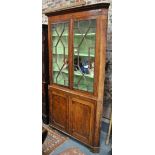 A George III oak corner cupboard,