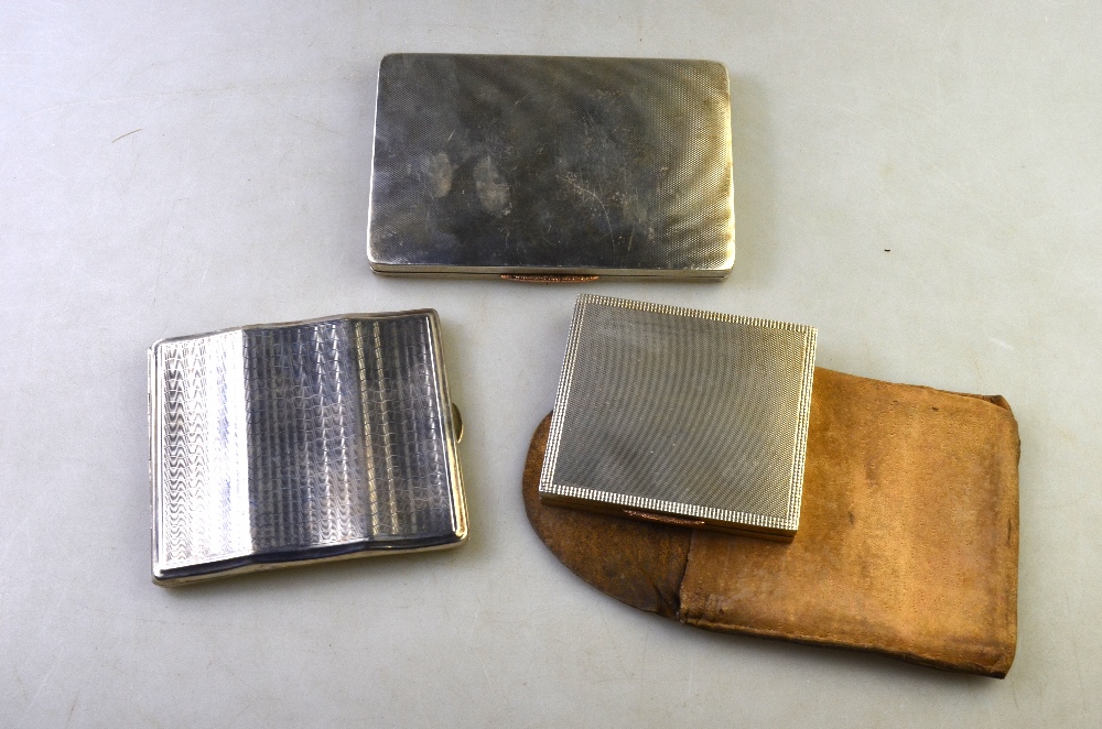 An engine-turned silver cigarette case of serpentine form, Birmingham 1931,