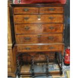 A 17th century feather-banded oak chest on stand, two short over three long graduated drawers,