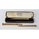 Three propelling pencils - one 9ct cased and two gilt metal (3)