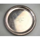A silver visiting card salver with egg and dart moulded border, Barker Brothers, Birmingham 1938, 6.