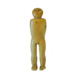 A marine ivory anthropomorphic carving of a standing figure attributed to the Thule or Inuit