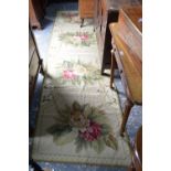 An Aubusson style wool runner with pale green ground with four floral design compartments,