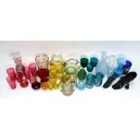 A collection of mostly 19th century English coloured glass including cranberry tumblers,