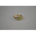 A 9ct yellow gold peridot and diamond cluster ring, yellow gold carved setting, approx 2g,