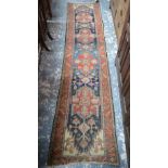 An old Hamadan runner, the medallion pole design on blue ground,