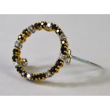 An 18ct yellow and white gold sapphire and diamond set circlet brooch