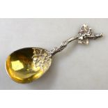 A Victorian silver caddy spoon with cast vine-stock handle and gilt fig-shaped bowl,