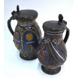 Two 19th century pottery German steins with pewter lids,