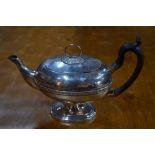 A 19th century German white metal oval teapot on stemmed foot, by Seethaler of Ausberg, 23.