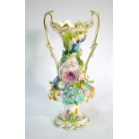 A 19th century English twin handle vase in the Rockingham style,