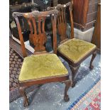 A good pair of 18th century walnut side chairs the top rails centred by a moulded shell motif