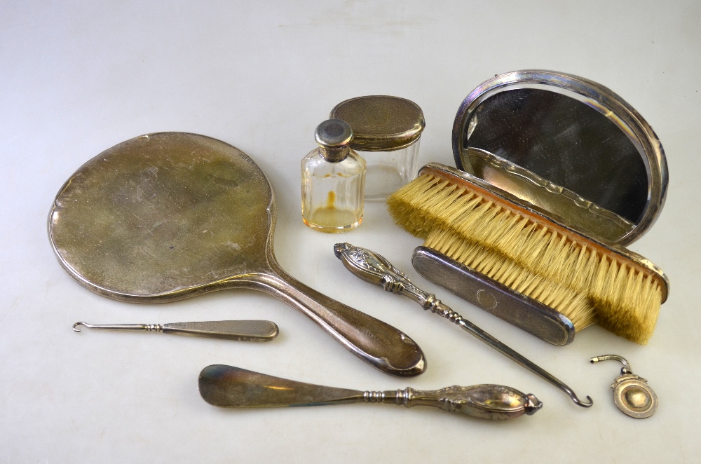 Two silver mirrors, toilet jars, button hooks and shoe horn, sports medallion, etc.