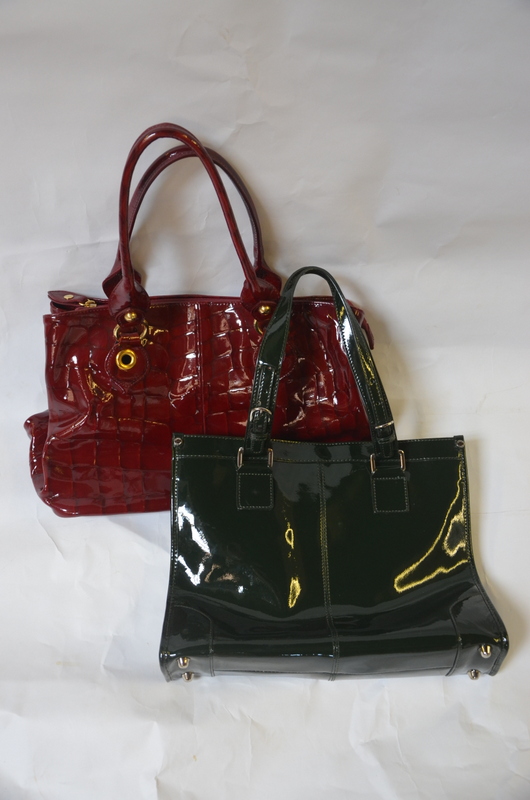 A Russell & Bromley red patent shopper with gilt detail, a Jaeger green patent tote bag,