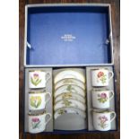 A Royal Worcester gilt edged Botanical specimen coffee service in a presentation box