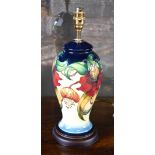 Moorcroft table lamp base decorated in the Anna Lily pattern designed by Nicola Slaney,