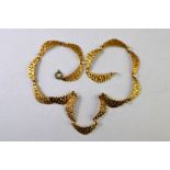 A 9ct yellow gold fancy-linked textured necklace having gilt metal snap,