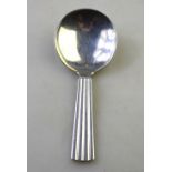 A Georg Jensen silver Bernadotte pattern caddy spoon with Art Deco style reeded handle,