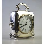A late Victorian silver-cased boudoir clock with scroll top-handle,