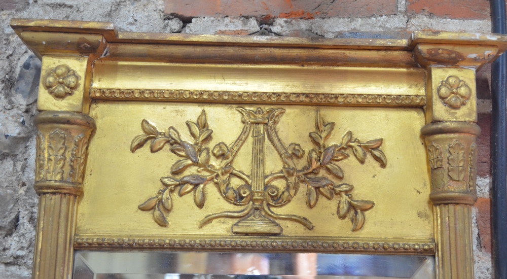 A small Regency gilt-framed pier glass with cornice tip and reeded pilasters, - Image 3 of 3