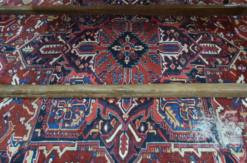 A Persian Heriz carpet, the large central blue medallion on red ground with stylised floral design, - Image 3 of 7