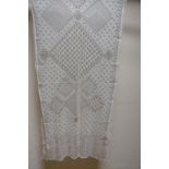 A 1920s cream silvered metal Egyptian assuit shawl with geometric design,