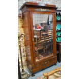 An Italian figured mahogany mirrored door armoire with drawer to base, raised on moulded paw feet,