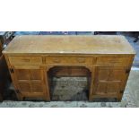 A Yorkshire golden oak kneehole desk/dressing table by Kingpost,