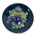 Moorcroft plate decorated with three birds, plums and grapes by Jackie Norcup (Rowe),